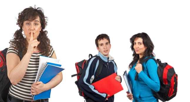 Three students with books and backpacks