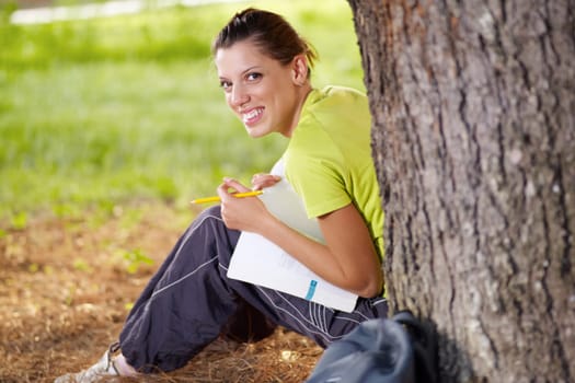 college student looking back and smiling. Copy space