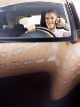 woman driving car and talking on mobile phone. Copy space