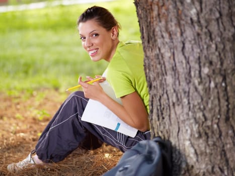 college student looking back and smiling. Copy space
