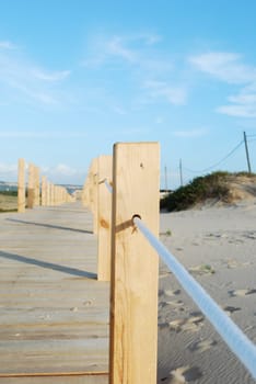 Close up of a boardwalk entering the beach