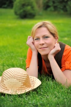 Young woman laying on the grass