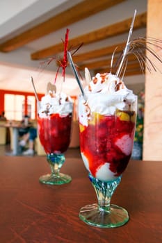 sundae full of fresh fruit and ice cream in sweetshop