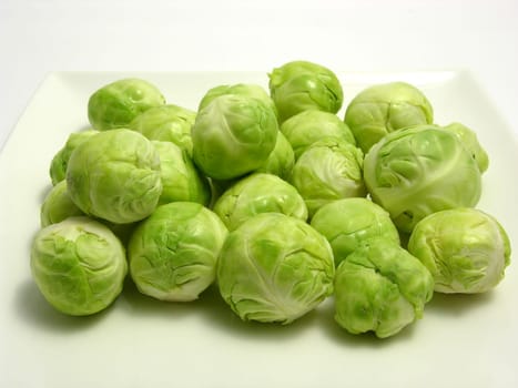 Brussels sprouts on white plate