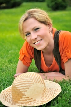Young woman laying on the grass