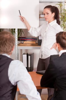 woman talks to audience in office