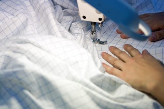 Tailor repairing clothes
