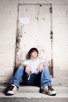 teenager with handgun