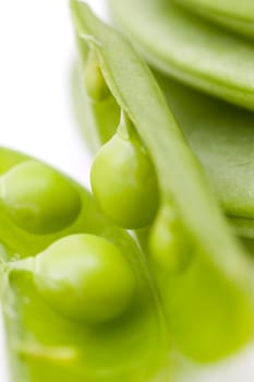 fresh peas on wooden background