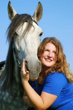 Young woman with horse