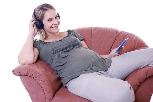 Pregnant woman listens to music