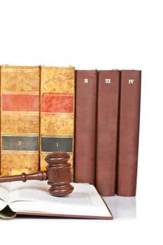 Wooden gavel and old law books