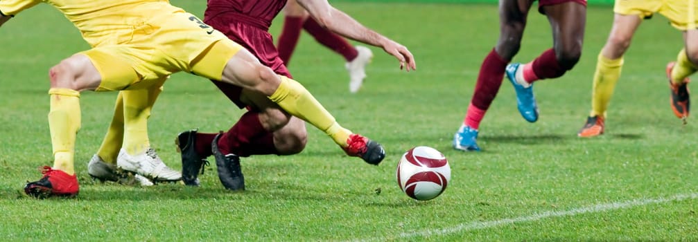 Soccer player kicking the ball