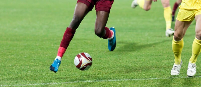 Soccer player kicking the ball