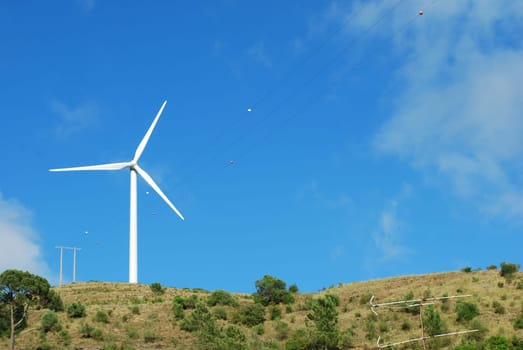 Wind turbine on the top of a mountain