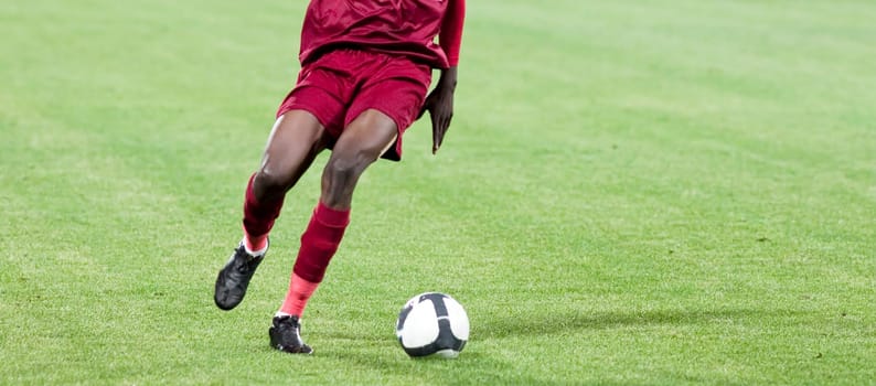 Soccer player kicking the ball