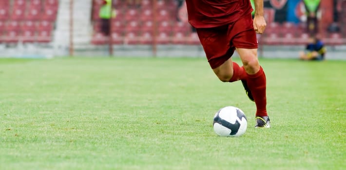 Soccer player kicking the ball