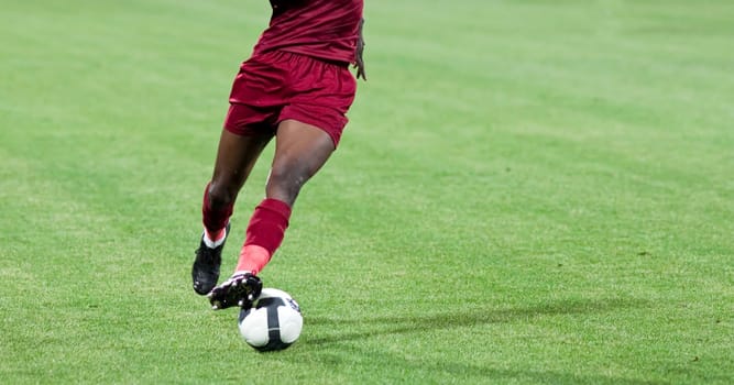 Soccer player kicking the ball