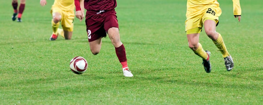 Soccer player kicking the ball
