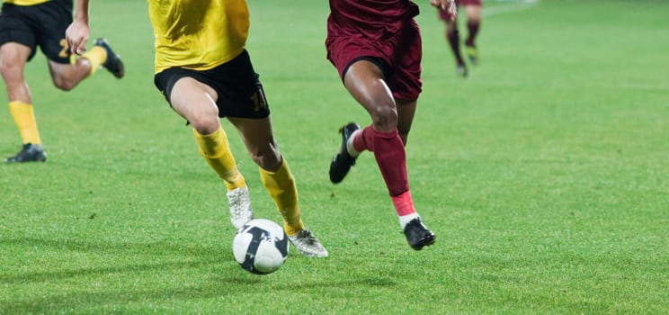 Soccer players fighting for the ball