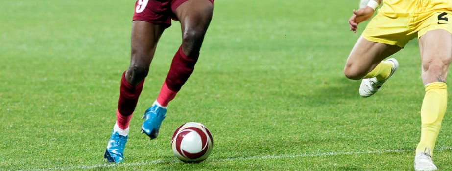Soccer player kicking the ball