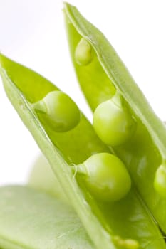 fresh peas on wooden background