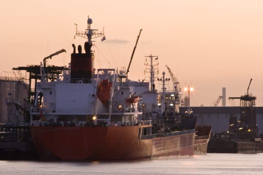 Ships in port at red sunrise