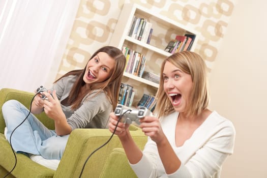 Two female students playing TV games