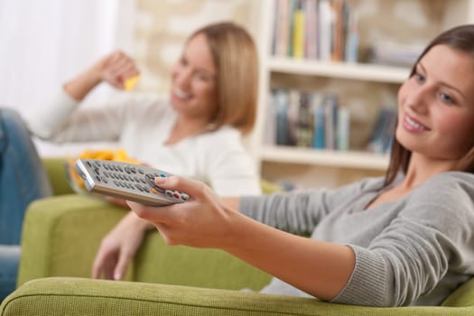 Two female students watching television