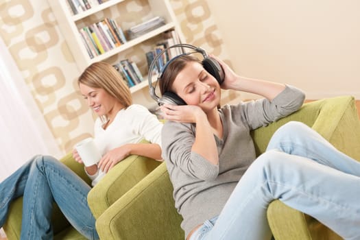 Two female students relaxing home