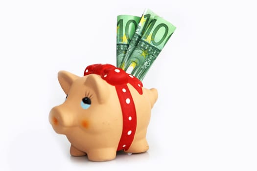 a piggy bank with three 100 euro notes