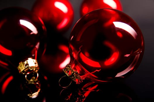 red christmas ball in front of dark background