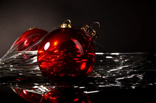 red christmas ball in front of dark background