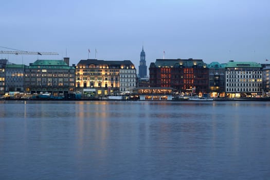 Hamburg's Inner Alster shortly after sunrise on a gray autumn morning