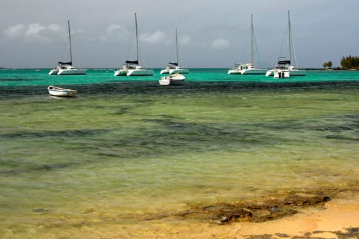 Mooring for catamarans in the turquoise waters on the coast of Mauritius