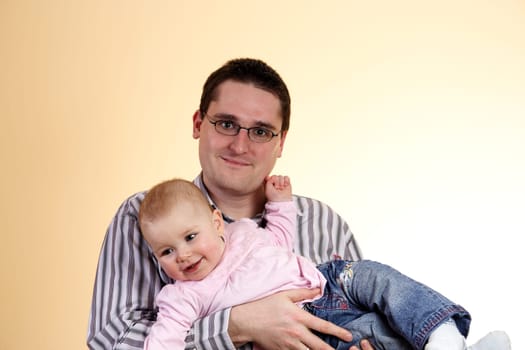 Father with daughter in his arms