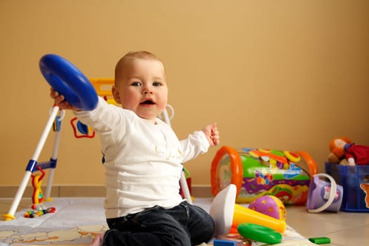 Baby playing in living room at home