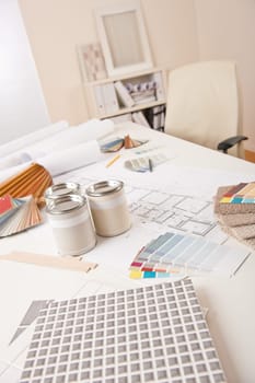 Office of interior designer with paint and color swatch