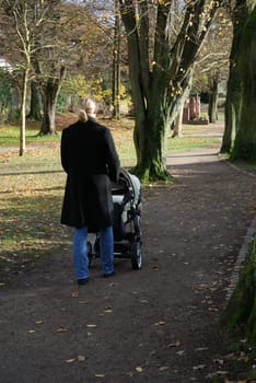 Young mother walking in the park