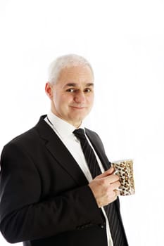 A friendly, elderly gentleman in a suit drinking coffee