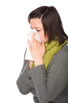 Woman blowing her nose
