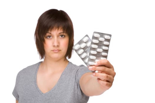 Young woman with a pack of tablets