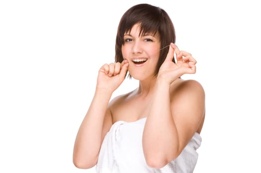 Young woman using dental floss