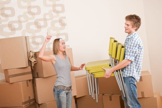 Moving house Couple unpacking box