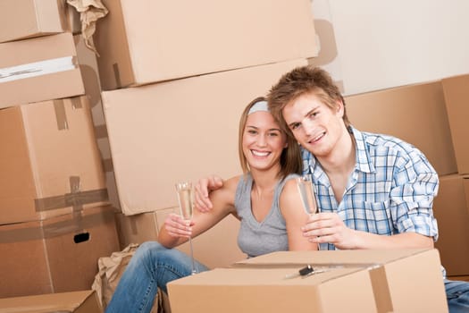 Moving house Couple unpacking box