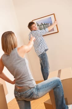 Moving house Couple unpacking box