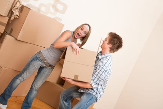 Moving house Couple unpacking box