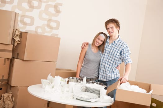 Moving house Couple unpacking box