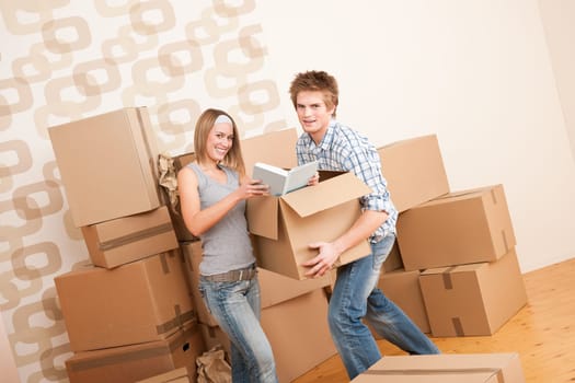 Moving house Couple unpacking box
