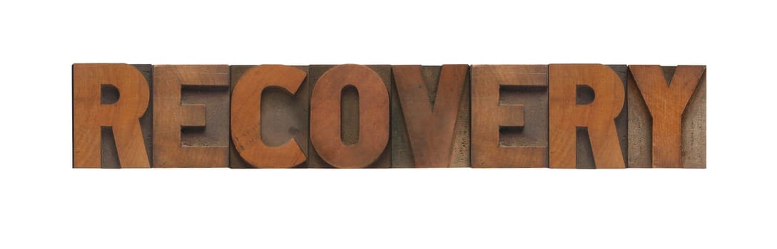 the word recovery in old wood type